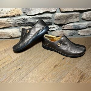 Women’s size 11 Clarks leather slip on shoes